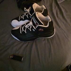 JordanJumpman Sneaker Line Men's Black and White Athletic Shoes.